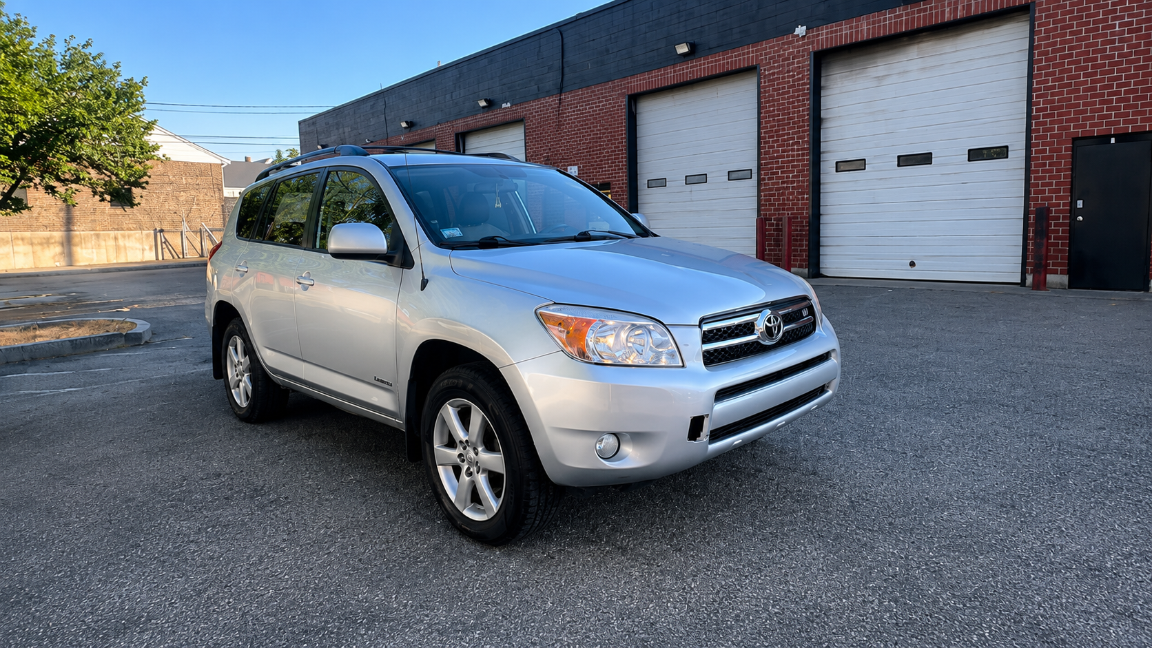 Completed collision repair of a silver Toyota RAV4 at WL Auto Collision in Brockton, Massachusetts.