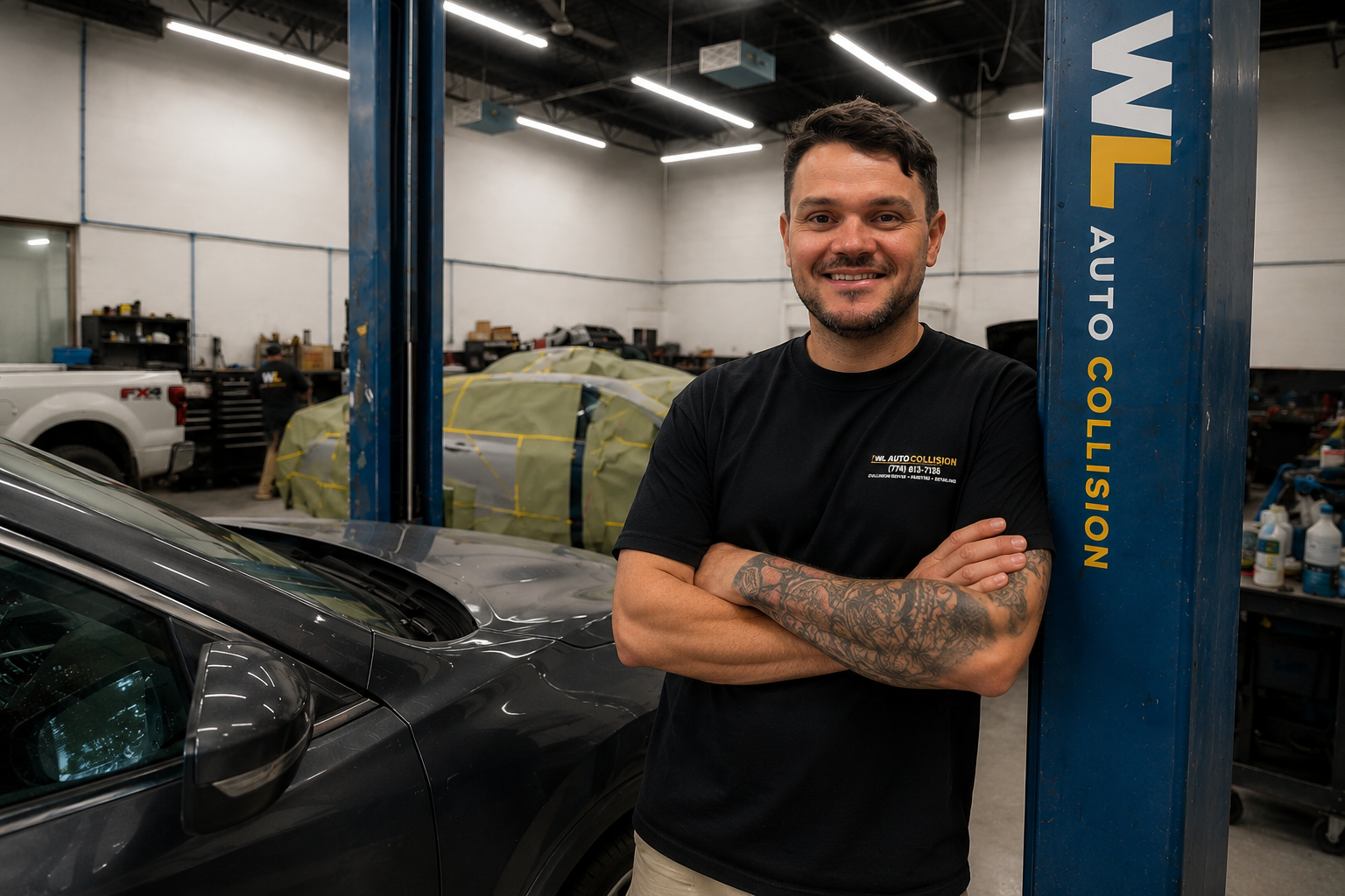 Wesley, owner of WL Auto Collision, inside the collision repair facility in Brockton, Massachusetts.